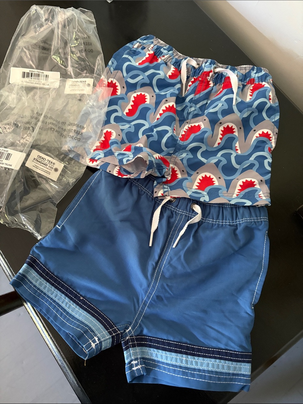 Hanna Andersson Blue Shark Wave and blue Colorblock swim trunks Kids Swim Trunks